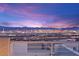 Breathtaking city views from this rooftop deck provide a stunning backdrop for entertaining and relaxing at 11676 Midnight Melody Ave, Las Vegas, NV 89138