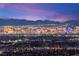 Stunning panoramic view of the Las Vegas city skyline at dusk, showcasing bright lights at 11676 Midnight Melody Ave, Las Vegas, NV 89138