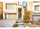 Charming home exterior with a well-manicured front yard, driveway, and inviting entrance at 11676 Midnight Melody Ave, Las Vegas, NV 89138