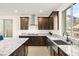 Modern kitchen featuring an island, stainless steel appliances, granite countertops, and mountain view at 11676 Midnight Melody Ave, Las Vegas, NV 89138