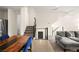 Spacious living area featuring a modern staircase, open layout, and stylish furnishings at 11676 Midnight Melody Ave, Las Vegas, NV 89138