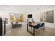 Open living space with modern fireplace, large TV, and sliding glass doors to a balcony at 11676 Midnight Melody Ave, Las Vegas, NV 89138