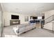 Open-concept living area boasts a modern fireplace, ample seating, and seamless access to the kitchen at 11676 Midnight Melody Ave, Las Vegas, NV 89138