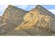 Dramatic view of a rugged mountain peak under a clear blue sky at 11676 Midnight Melody Ave, Las Vegas, NV 89138