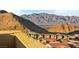 Scenic view of a residential neighborhood nestled against a backdrop of mountains at 11676 Midnight Melody Ave, Las Vegas, NV 89138