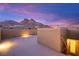 Rooftop deck with mountain views, stucco privacy wall, and access to the interior at 11676 Midnight Melody Ave, Las Vegas, NV 89138