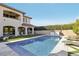 Serene backyard with pool, manicured lawn, and an inviting patio area at 11878 Albissola Ave, Las Vegas, NV 89138