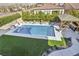 Lovely backyard pool area with a gazebo, lounge chairs, and lush landscaping, ideal for relaxation at 11878 Albissola Ave, Las Vegas, NV 89138