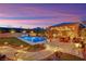 Inviting backyard pool and outdoor dining area, perfect for entertaining guests and enjoying serene evenings at 11878 Albissola Ave, Las Vegas, NV 89138