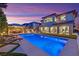 Stunning backyard with a refreshing pool, a covered patio, and a spacious outdoor entertaining area at 11878 Albissola Ave, Las Vegas, NV 89138