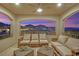 Inviting outdoor seating with mountain views from this home's second story balcony at 11878 Albissola Ave, Las Vegas, NV 89138