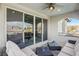 Outdoor balcony showcases plush seating and a ceiling fan to keep you cool at 11878 Albissola Ave, Las Vegas, NV 89138