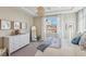 Bright bedroom with a view, neutral walls and carpet flooring and lots of natural light at 11878 Albissola Ave, Las Vegas, NV 89138