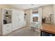 Bright room with white Murphy bed system, white desk by window, and neutral accents at 11878 Albissola Ave, Las Vegas, NV 89138