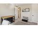 A simple room provides a stylish open entrance to the bathroom with decor and carpeted floors at 11878 Albissola Ave, Las Vegas, NV 89138