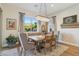 Dining room features a window, chandelier, and plenty of space to entertain at 11878 Albissola Ave, Las Vegas, NV 89138