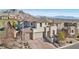 Aerial view of home displaying brick driveway, three car garage and mountain views at 11878 Albissola Ave, Las Vegas, NV 89138