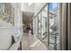 Bright hallway with sliding glass doors leading to a cozy outdoor courtyard at 11878 Albissola Ave, Las Vegas, NV 89138