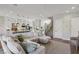 Spacious living room featuring hardwood floors, recessed lighting, open floor plan, and a staircase at 11878 Albissola Ave, Las Vegas, NV 89138