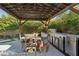 Covered outdoor kitchen and dining area featuring a grill and stainless steel appliances at 11878 Albissola Ave, Las Vegas, NV 89138