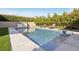 Refreshing backyard pool with lounge chairs and lush landscaping at 11878 Albissola Ave, Las Vegas, NV 89138