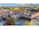 Aerial view of the property featuring a tile roof, multi-car garage and desert landscape at 11890 Tevare Ln # 1098, Las Vegas, NV 89138