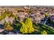 Aerial view of the neighborhood featuring mature trees and tile roofs at 11890 Tevare Ln # 1098, Las Vegas, NV 89138