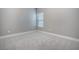 Neutral bedroom with a large window and plush carpeting at 11890 Tevare Ln # 1098, Las Vegas, NV 89138