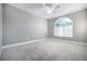 Airy bedroom featuring soft carpet, neutral paint, and a window with an arched top at 11890 Tevare Ln # 1098, Las Vegas, NV 89138
