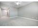 Neutral bedroom offering soft carpet flooring, a ceiling fan, and plenty of space at 11890 Tevare Ln # 1098, Las Vegas, NV 89138