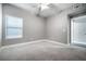 Spacious bedroom featuring plush carpet, a ceiling fan, and window with natural light at 11890 Tevare Ln # 1098, Las Vegas, NV 89138