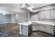 Open concept kitchen with an island and stainless steel dishwasher at 11890 Tevare Ln # 1098, Las Vegas, NV 89138