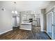 Modern kitchen with gray cabinets, stainless steel appliances, and dark-toned hardwood floors at 11890 Tevare Ln # 1098, Las Vegas, NV 89138