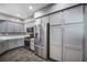 Modern kitchen with stainless steel appliances, gray cabinetry, and ample counter space at 11890 Tevare Ln # 1098, Las Vegas, NV 89138