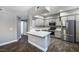 Well-equipped kitchen with stainless steel appliances, grey cabinets, and a breakfast bar at 11890 Tevare Ln # 1098, Las Vegas, NV 89138