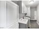 Well-equipped laundry room with gray cabinets, sink, and modern washer and dryer at 11890 Tevare Ln # 1098, Las Vegas, NV 89138