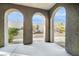 Covered patio featuring arched openings and views of the low-maintenance backyard at 11890 Tevare Ln # 1098, Las Vegas, NV 89138
