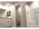 Contemporary bathroom with glass-enclosed shower and modern vanity at 12800 Oceano Dunes Ct, Henderson, NV 89044