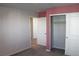 Cozy bedroom with closet, neutral walls, and doorway to other rooms at 12800 Oceano Dunes Ct, Henderson, NV 89044