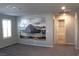 Spacious bedroom with carpet flooring and a desert-themed mural wall art at 12800 Oceano Dunes Ct, Henderson, NV 89044