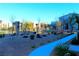 Community park with walking path, seating, and desert landscaping at 12800 Oceano Dunes Ct, Henderson, NV 89044