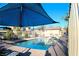 Enjoy a community pool with shade canopies and ample seating for residents at 12800 Oceano Dunes Ct, Henderson, NV 89044