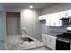 Well-equipped kitchen with granite counters, stainless steel appliances, and ample cabinet space at 12800 Oceano Dunes Ct, Henderson, NV 89044