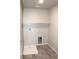 Functional laundry room with tile floors, convenient shelf, and utility connections at 12800 Oceano Dunes Ct, Henderson, NV 89044