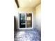 Covered patio with paved stone and sliding glass door that allows view of interior room at 12800 Oceano Dunes Ct, Henderson, NV 89044