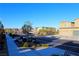 Street view of modern homes with well-maintained sidewalks and landscaping at 12800 Oceano Dunes Ct, Henderson, NV 89044