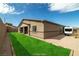 The home features a well-kept yard for outdoor activities, plus a generous patio with outdoor seating and desert landscaping at 135 Barnett Crest Ct, Henderson, NV 89015