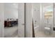 Cozy bathroom featuring tub, shower, and toilet plus doorway to another room at 135 Barnett Crest Ct, Henderson, NV 89015