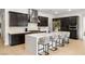 Spacious kitchen with white waterfall island, stainless steel appliances, dark cabinets, and marble backsplash at 135 Barnett Crest Ct, Henderson, NV 89015