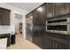 Kitchen features stainless steel appliances, dark cabinets, and marble backsplash at 135 Barnett Crest Ct, Henderson, NV 89015